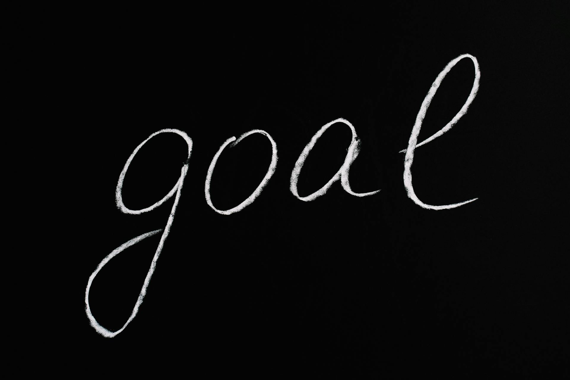 the word goal written on black board